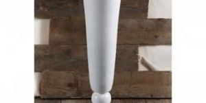 white Cylindrical vase for flowers on table and floor.