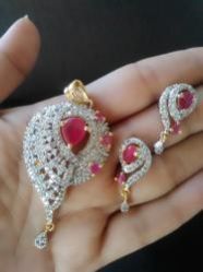 Frenzy AD Gold Diamond Designer Pendant Earring Set