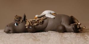 WONDERING HORSE SCULPTURE