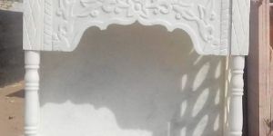 A white, Indian marble pooja temple.