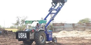 Powertrac Tractor Fitted Telescopic Husk Loader