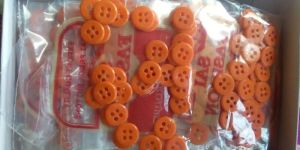 4 Hole Orange Plastic Round Urea Button