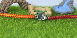 Vibrant Heart Shape Peacock Design Intricate Silver Rakhi