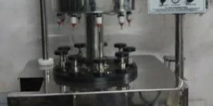 Vaccumetric 9 Head Rotary Perfume Filling Machine