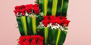 Stylish Tiered Red Rose Ensemble Green Box Arrangement
