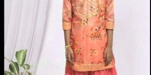Vibrant Deep Peach Churidar Attire for Girls