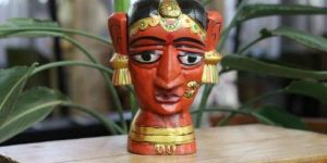 wooden gauri amba dark red sculpture