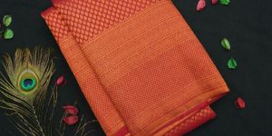Tomato Red Brocade Design Copper Zari Kanchipuram Silk Saree