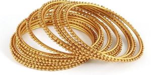 Sukkhi Glimmery Gold Plated Bangles for Women Set of 12