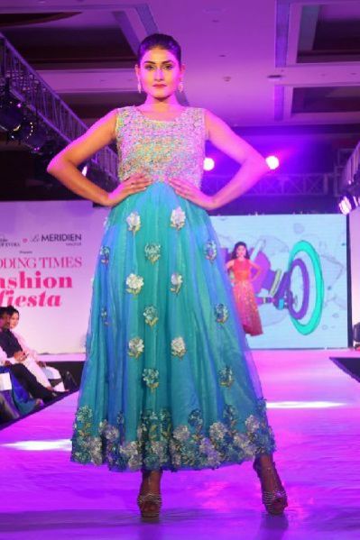 sleevless turquoise coloured full length gown applique work zari work