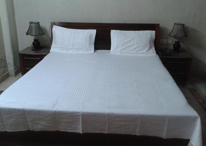 Satin stripe white bed sheet .sizes are avilable