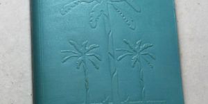 goat leather with banana tree embossed on the front .