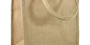 NATURAL UNPRINTED JUTE BAG WITH LUXURY SOFT HANDLE .