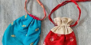 Silk potli bags, size and colour may be customised, wall decor of cross stitch, this may be customised too. The products can be acrylic framed an