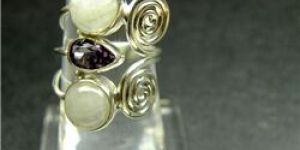 RAINBOW MOONSTONE CABOCHON AND AMETHYST FACET RING