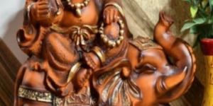 Polyresin Laughing Buddha Sitting on Elephant Statue