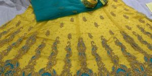 Ladies Yellow Fancy Net Lehenga Choli