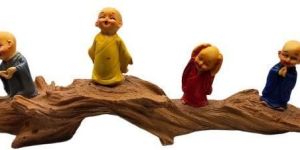 Little Monks Sitting on Tree Branch Sculpture