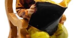 Lord Ganesha Reading Book Statue