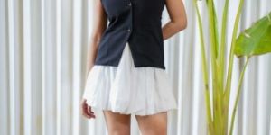 Black sleeveless blazer with puffed white skirt co-ord set