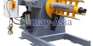 DECOILER WITH HOLD DOWN ARM