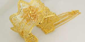 Graceful Gold Filigree Cuff with Floral Vines