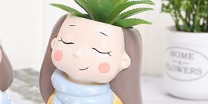 Resin Round Yellow Girl Planter Pot