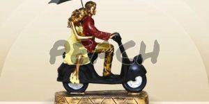 Romantic Couple on Scooter Statue