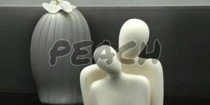 White Ceramic Couple Statue