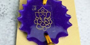 Purple Resin Rakhi with Ganesh Ji