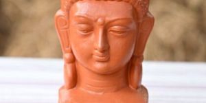 clay buddha head statue