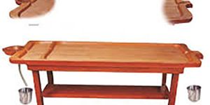traditional wooden panchakarma massage table