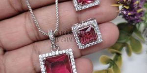 Ladies Brass Party Wear Pink Stone Pendant Set
