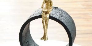 Black & Gold Circular Focused Sitting Figure Sculpture