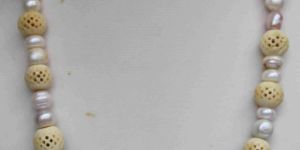 Natural Cultured Pearls Necklace with Bone Sculptures