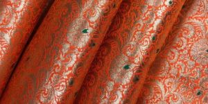Orange Jaal Brocade Fabric