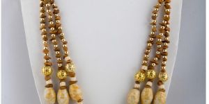 Fashion Necklaces - three-layered neck piece attached to white Pearls.