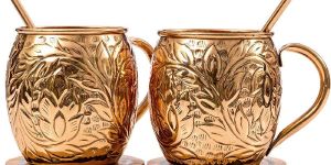 COPPER MUG WITH BRASS HANDLE.